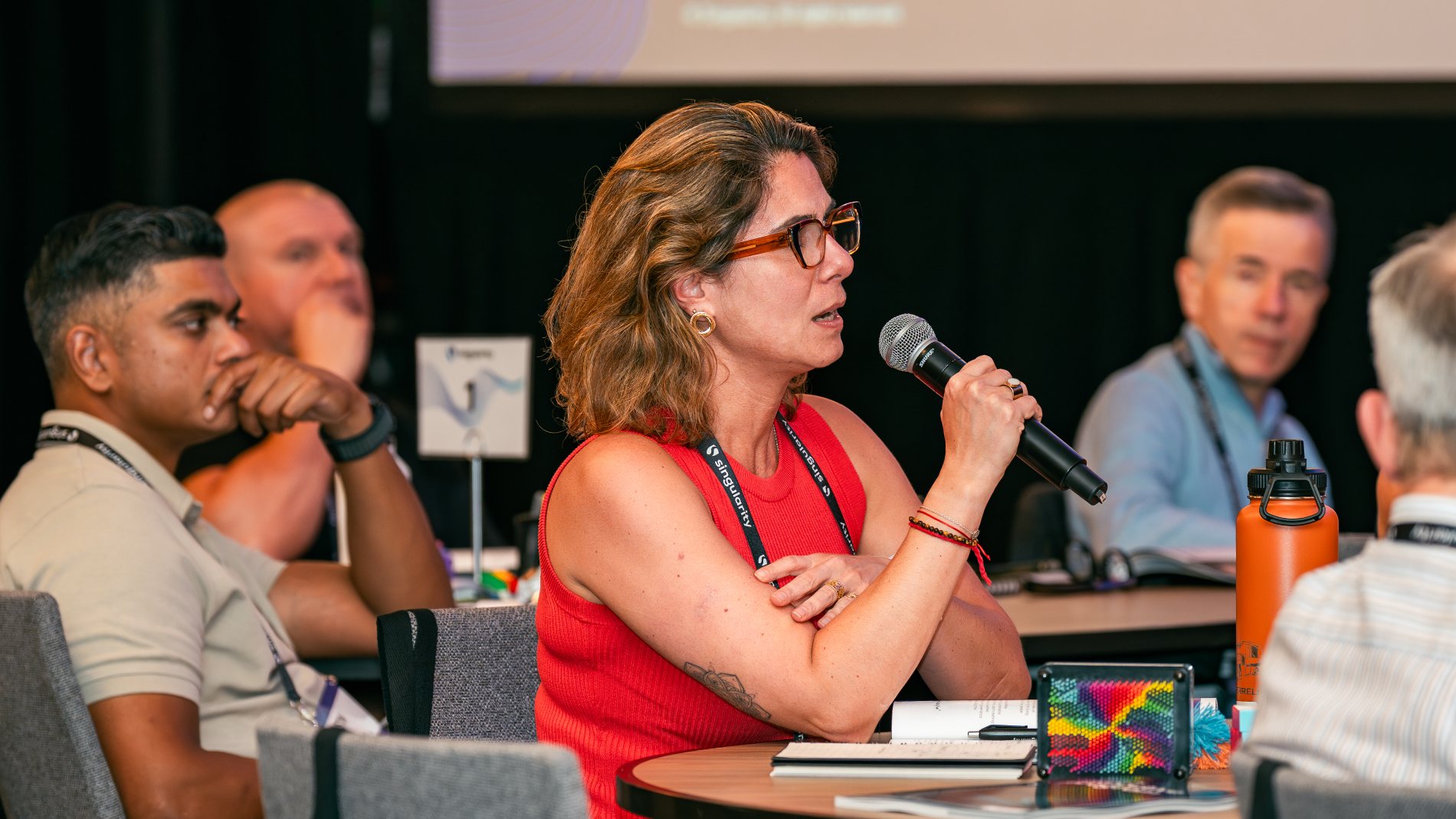 A participant asking a question during an executive programme